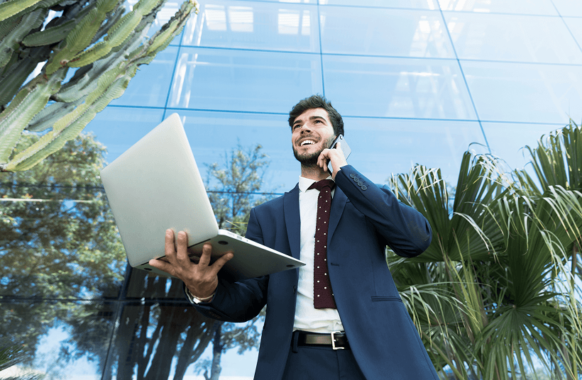 Entrepreneur using a laptop outdoors