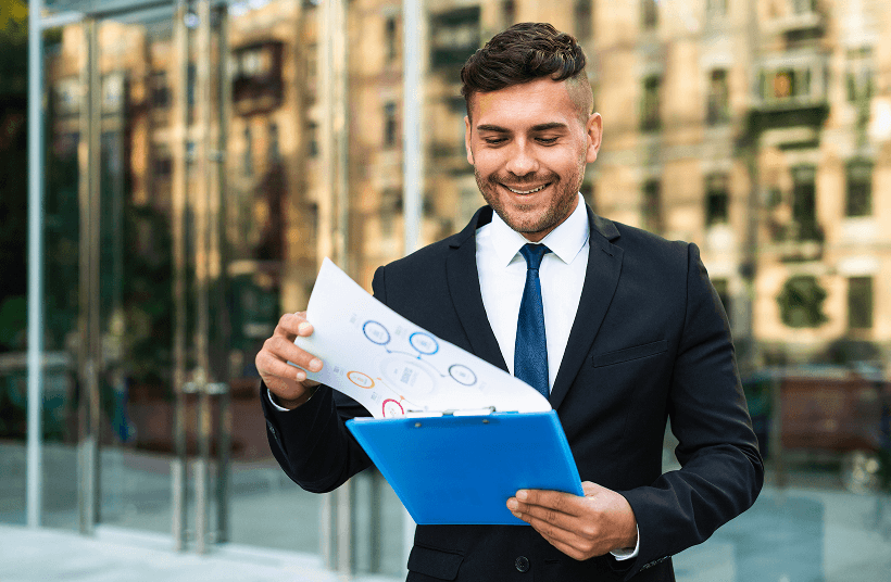 Investor reviewing documents in a business district